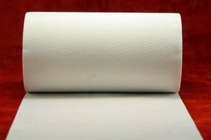 A roll of T.P. on a red background